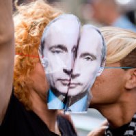 Paris: Demonstrators wearing masks depicting Russian President Vladimir Putin kiss as they take part in a rally in front of the Russian embassy in Paris on September 8, to protest against antigay Russian laws.