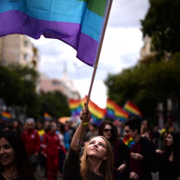 Sofia, Bulgaria: A woman waves a rainbow flag during the annual Gay Pride parade in central Sofia on September 21, 2013 as gays, lesbians and transsexuals march through the Bulgarian capital to protest against discrimination against homosexuals and call for their better integration into society.